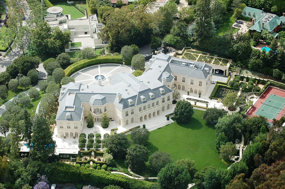 Aerial view of The Manor in Holmby Hills, a large French-chateau-style mansion with formal gardens and a tennis court